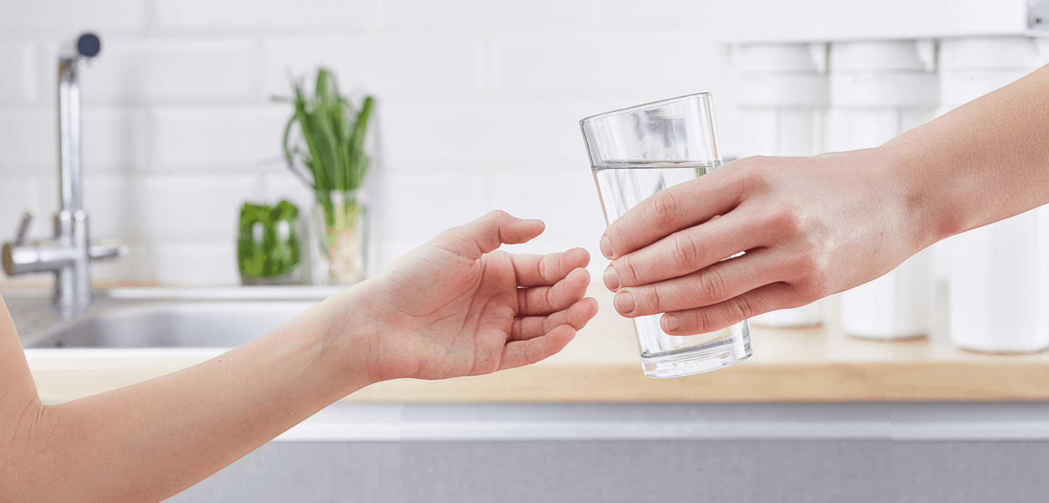 handing over a full glass clean water